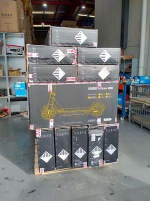 a pallet full of refurbished segway ninebot max is placed in the warehouse